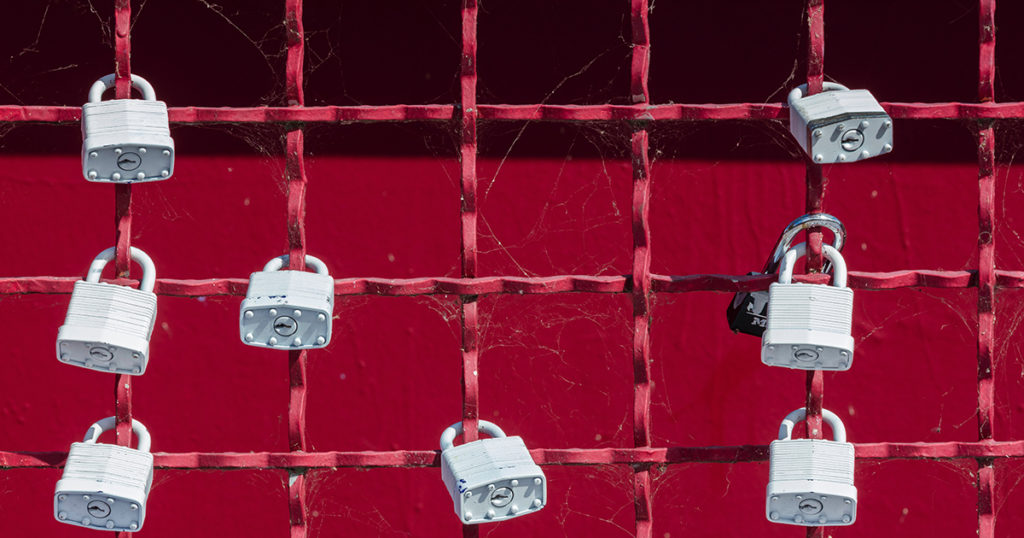 locks on a red fence